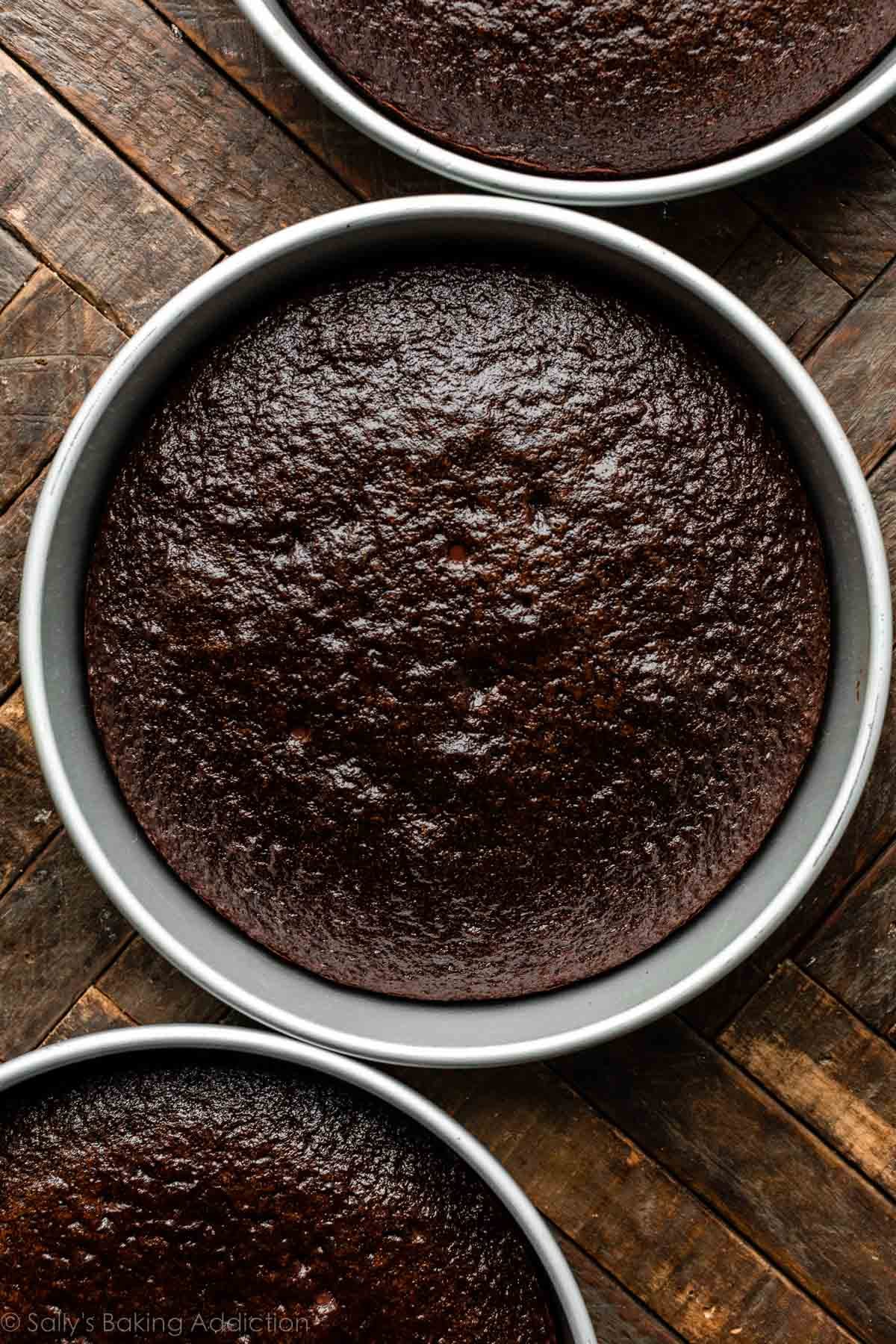 3 chocolate cake layers each in a round cake pan.
