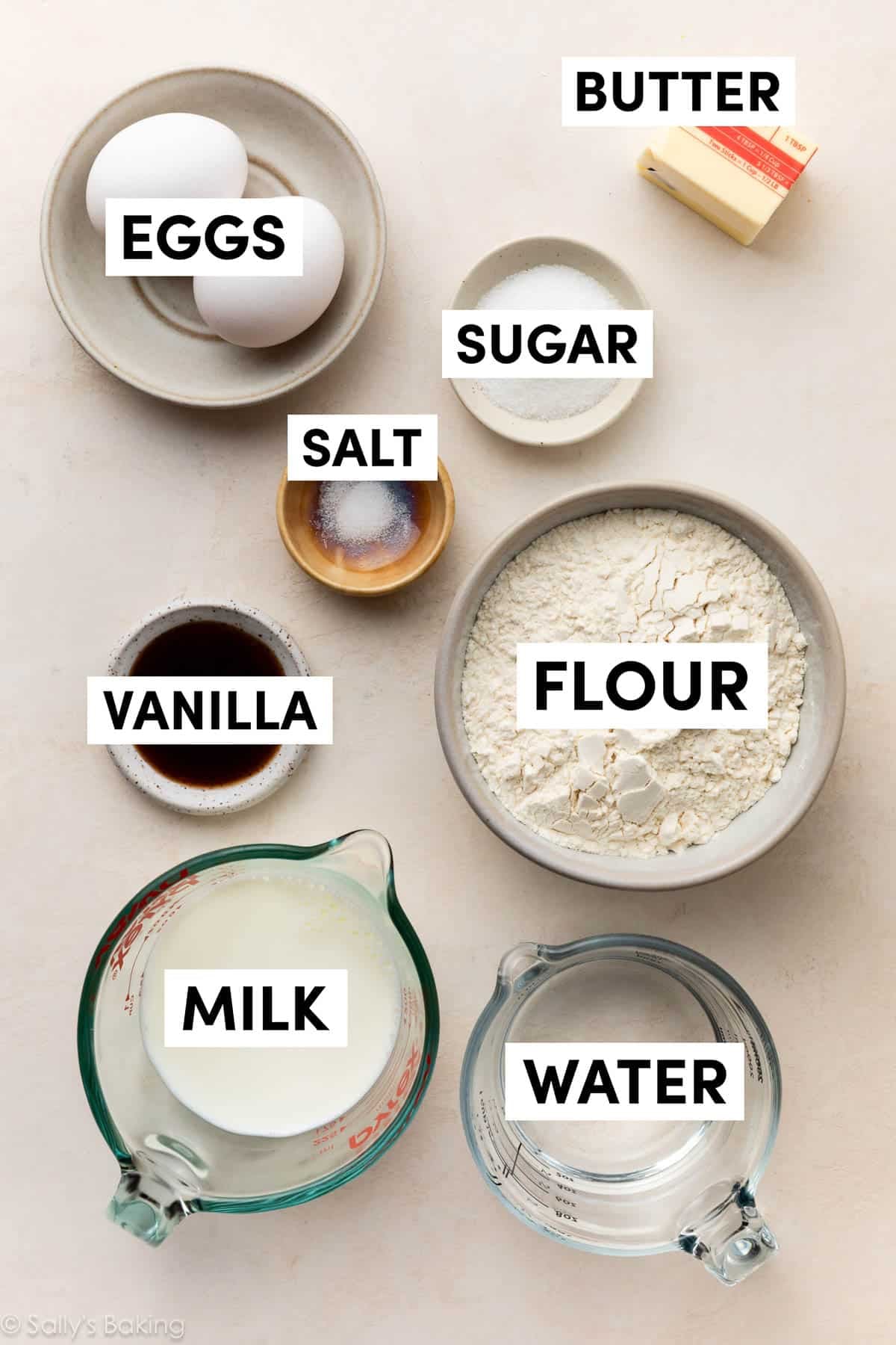 ingredients in bowls including flour, eggs, water, milk, sugar, and vanilla.