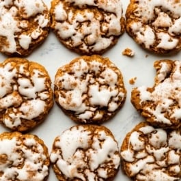 pumpkin oatmeal cookies with brown butter icing on top.