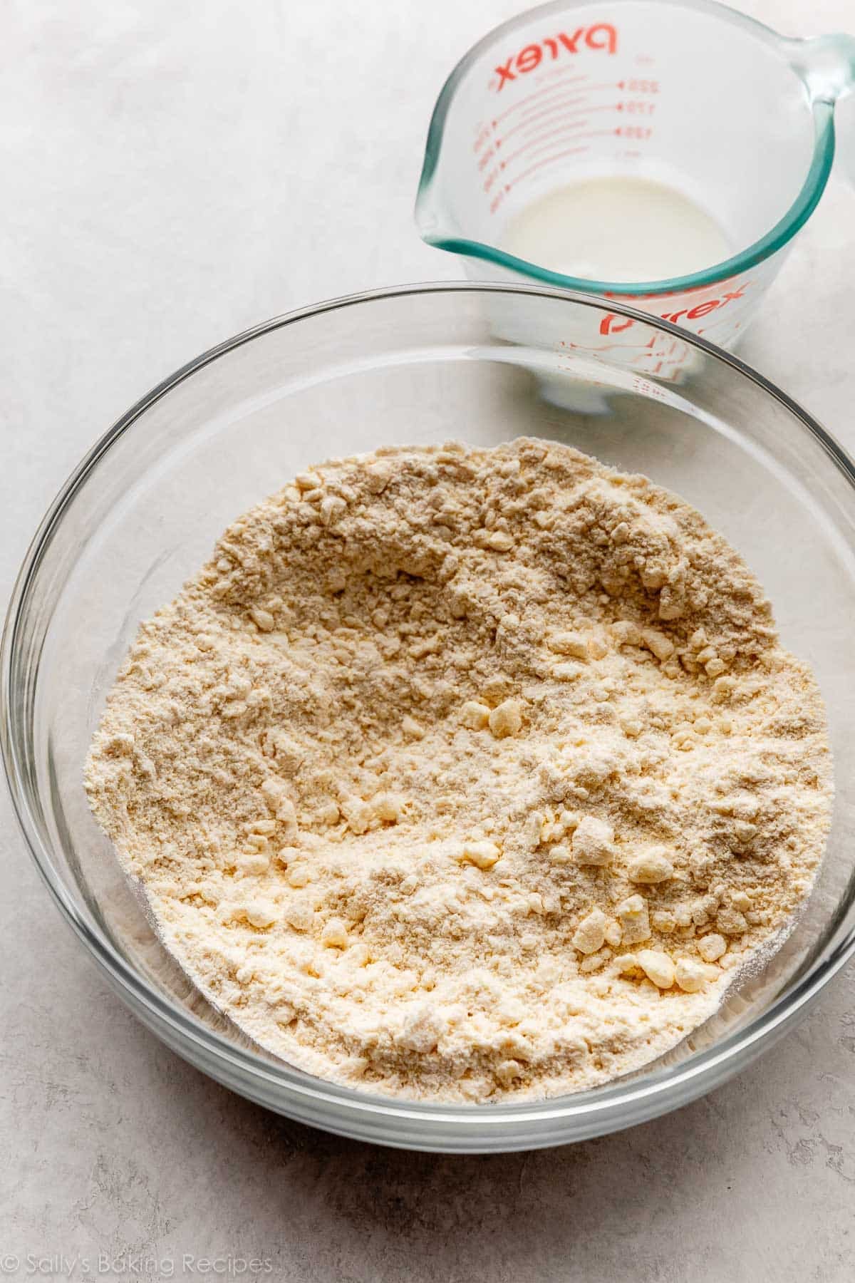 dry ingredients with cold butter cut in in glass bowl.