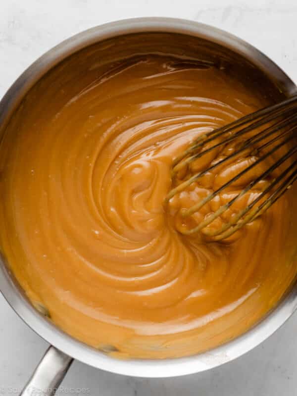 butterscotch filling with whisk in pot.