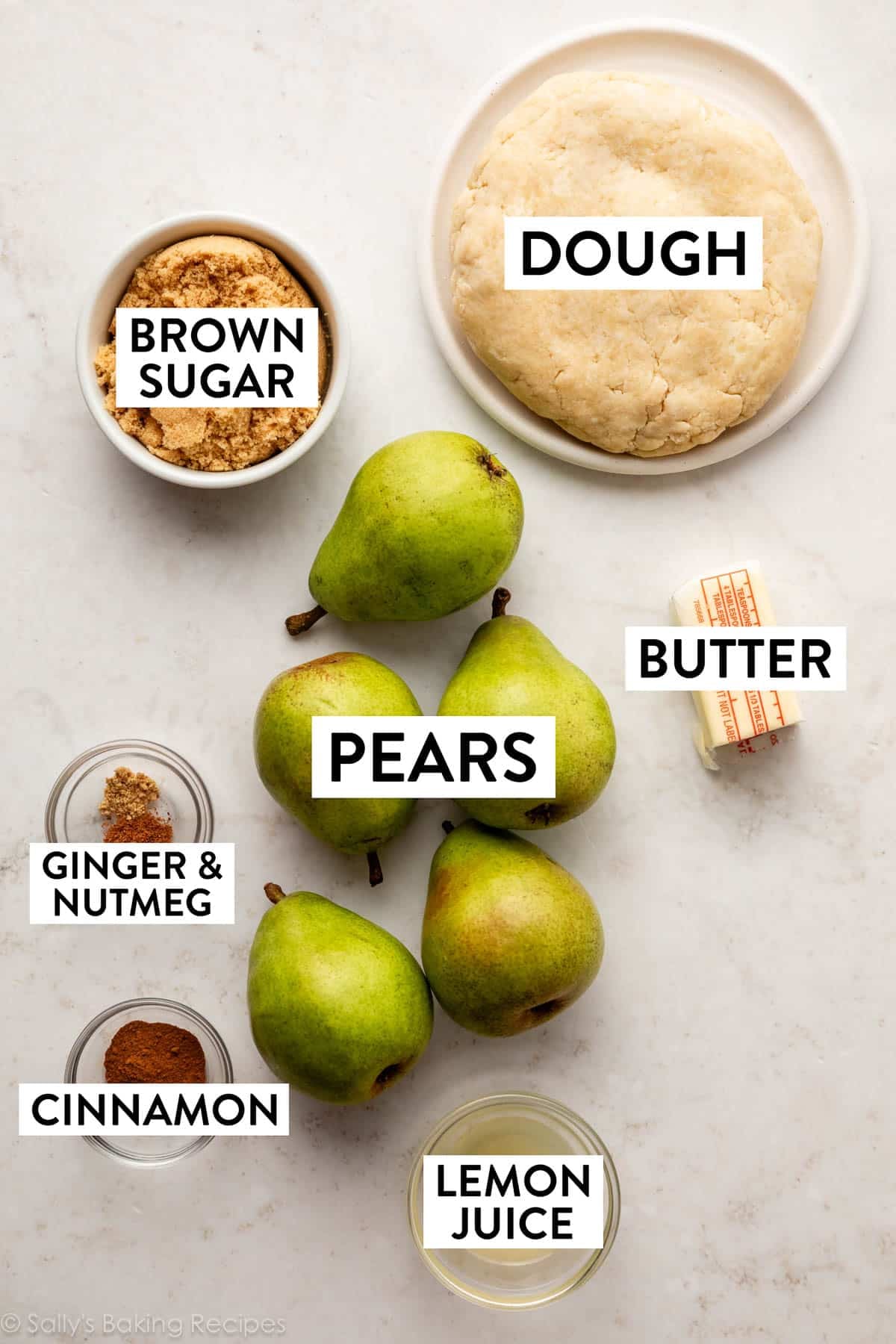 ingredients on counter including dough, brown sugar, lemon juice, butter, and cinnamon.