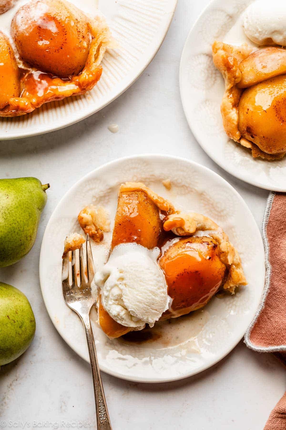 tarte tatin slice on white plate.