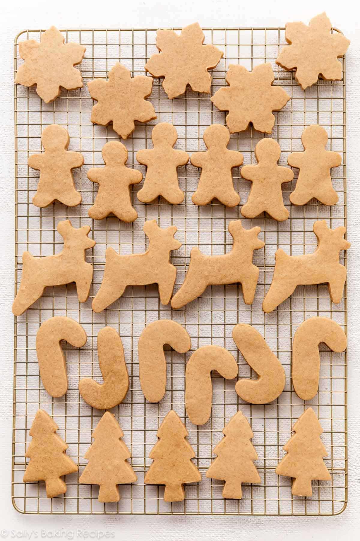 baked brown sugar cookie cutter cookies on gold cooling rack.