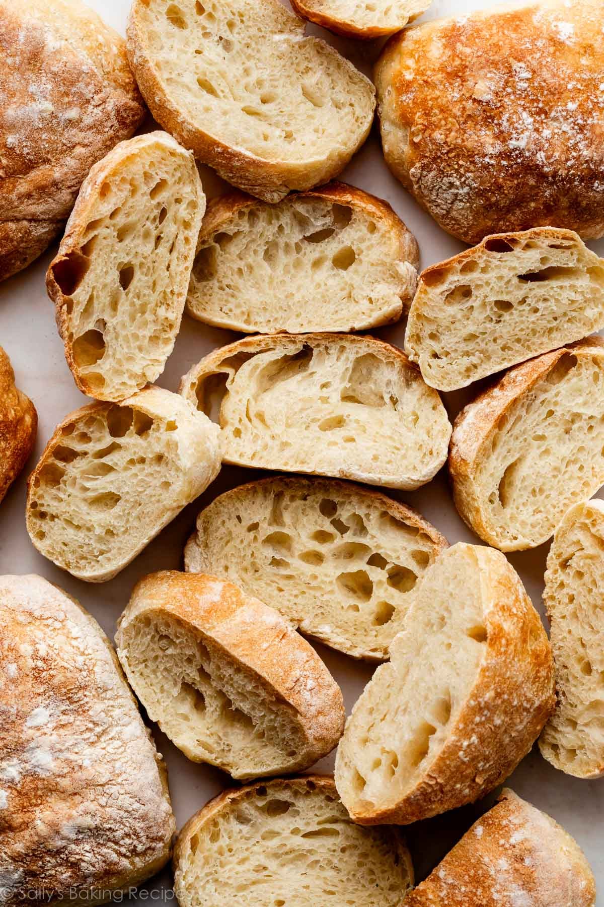 overhead photo of sliced ciabatta bread interior with airy holes.