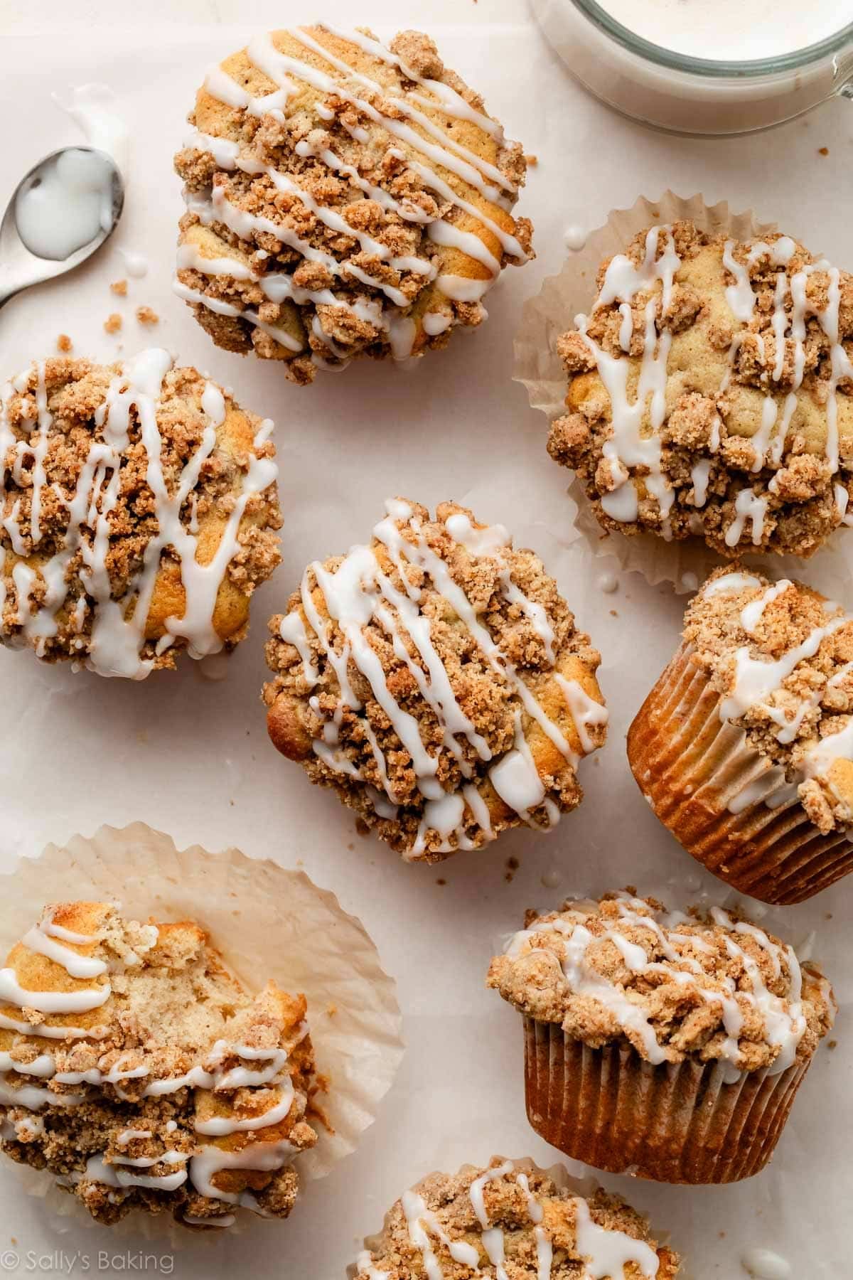 crumb cake muffins with icing on top.