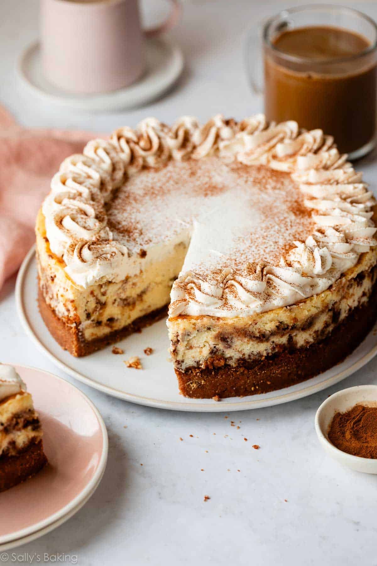 cinnamon swirl cheesecake with whipped cream.