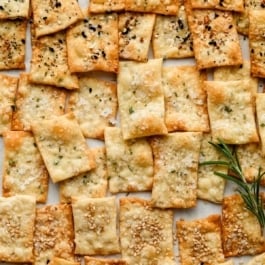 homemade crackers in various flavors including everything bagel, rosemary, and sesame seed.