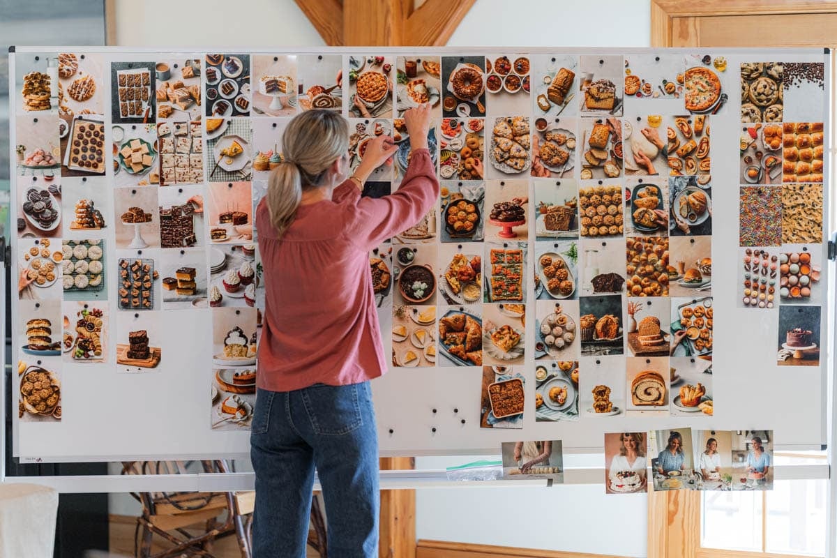 Sally with photos on big board.