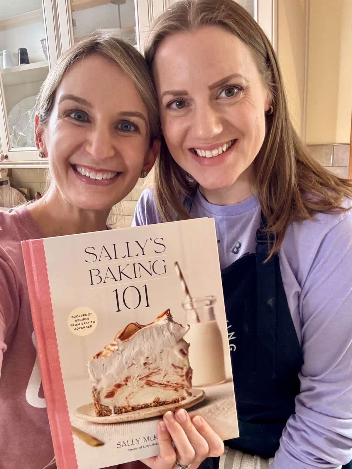 Sally and Beth holding Sally's Baking 101.