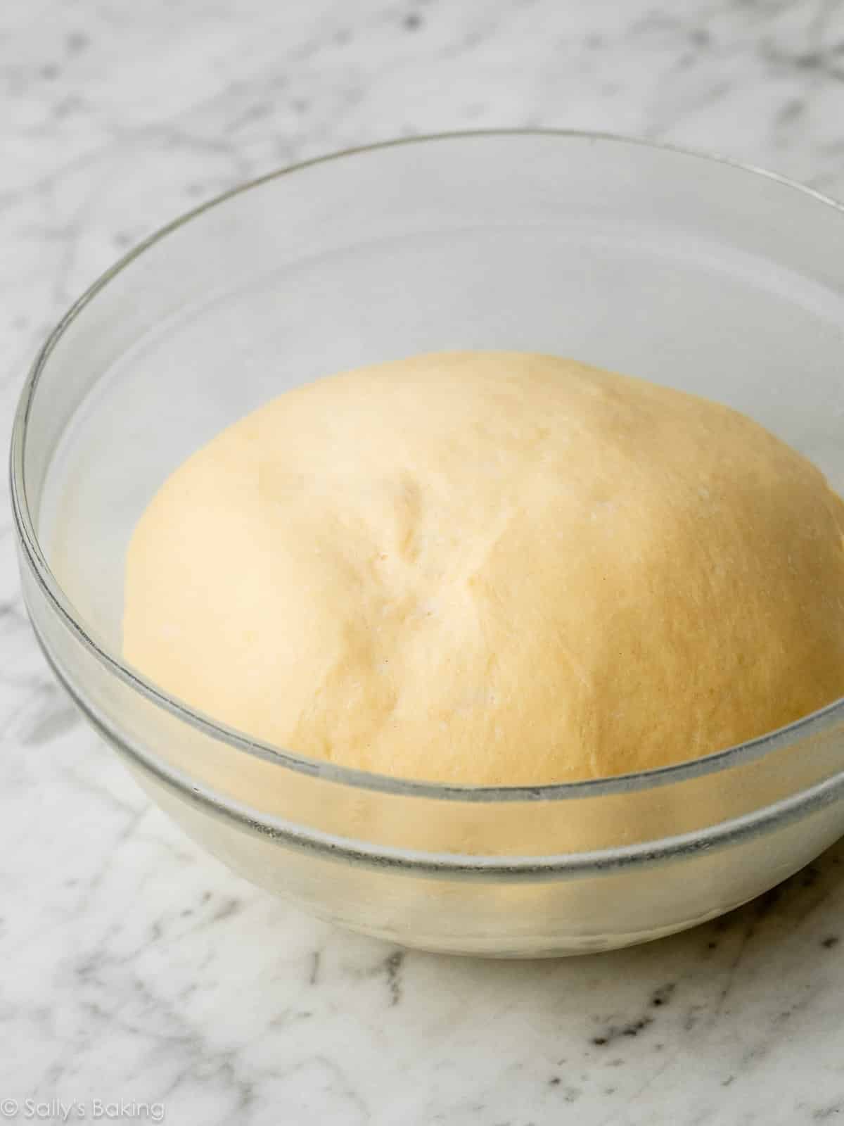 dough in glass bowl.