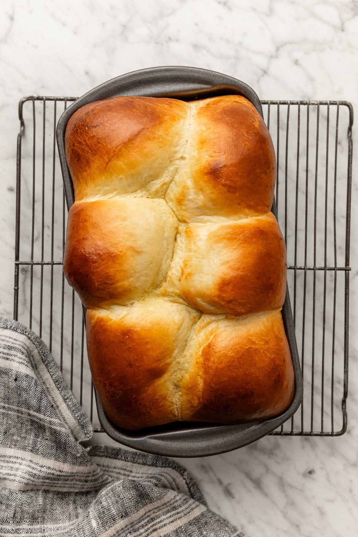 overhead photo of brioche bread in loaf pan.