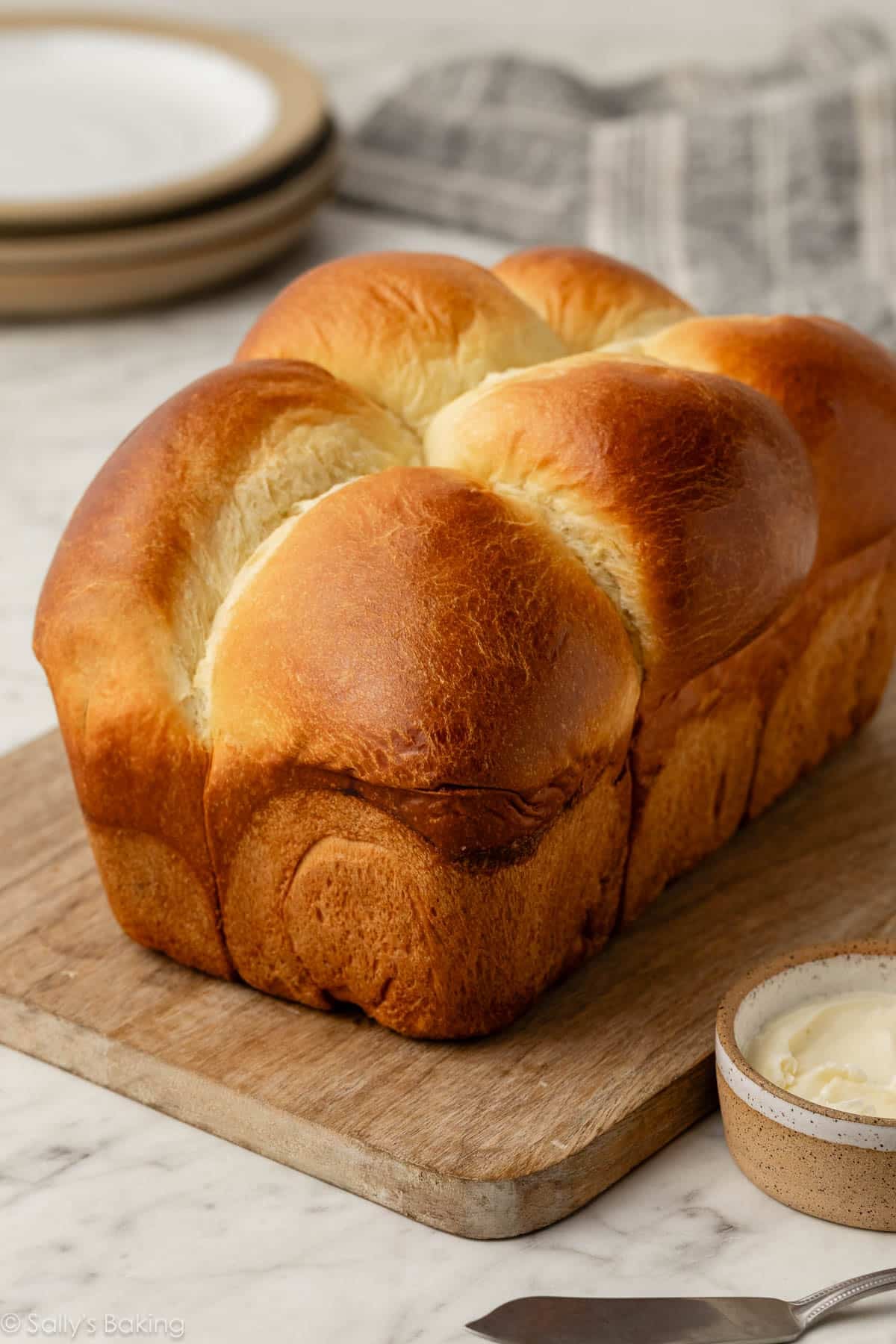 brioche loaf on cutting board.