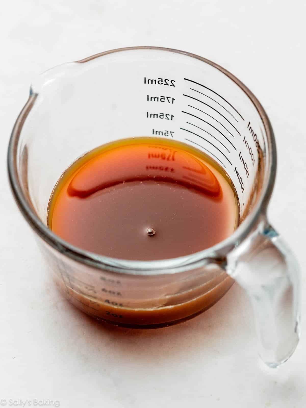 apple cider in liquid measuring cup.
