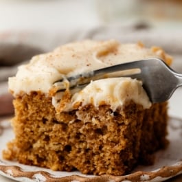 piece of spice cake with brown butter cream cheese frosting.