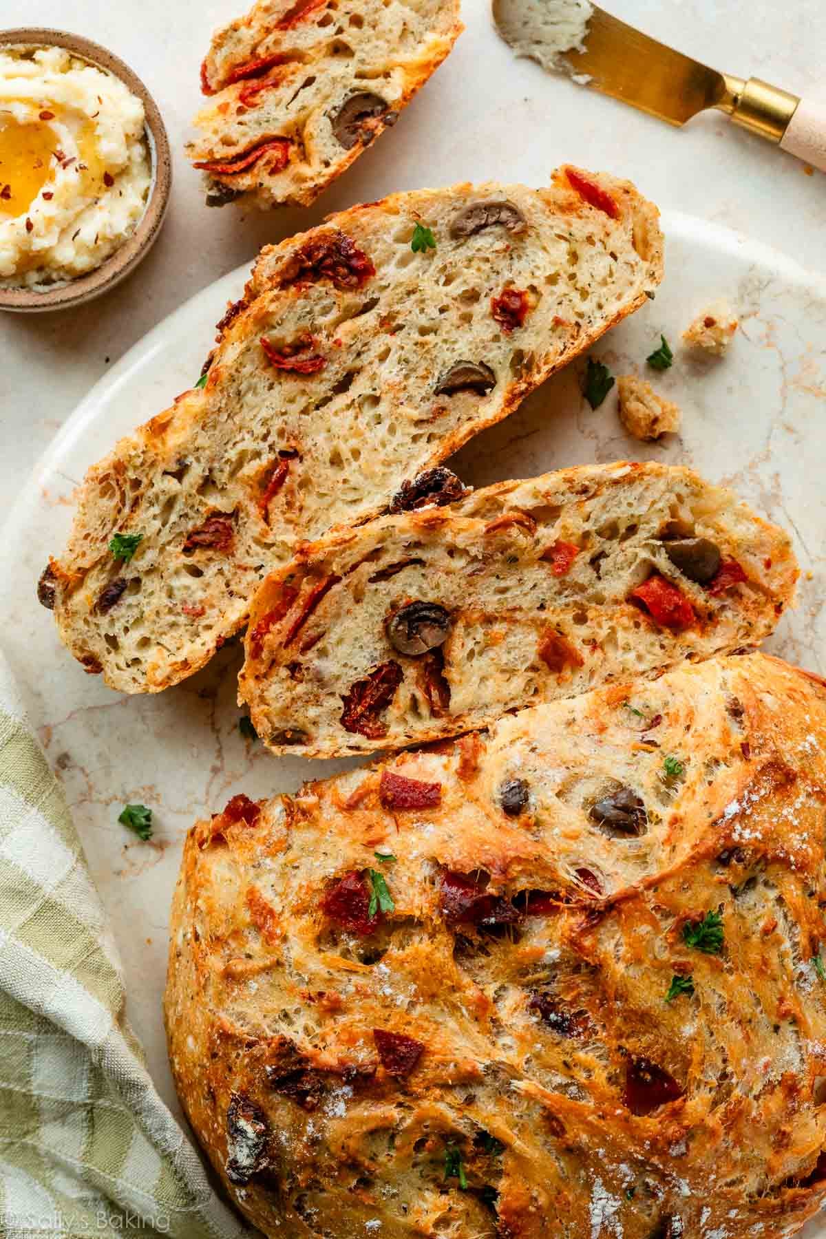 pizza bread with pepperoni, olives, and fresh parsley.