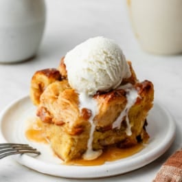 piece of bread pudding with vanilla ice cream.