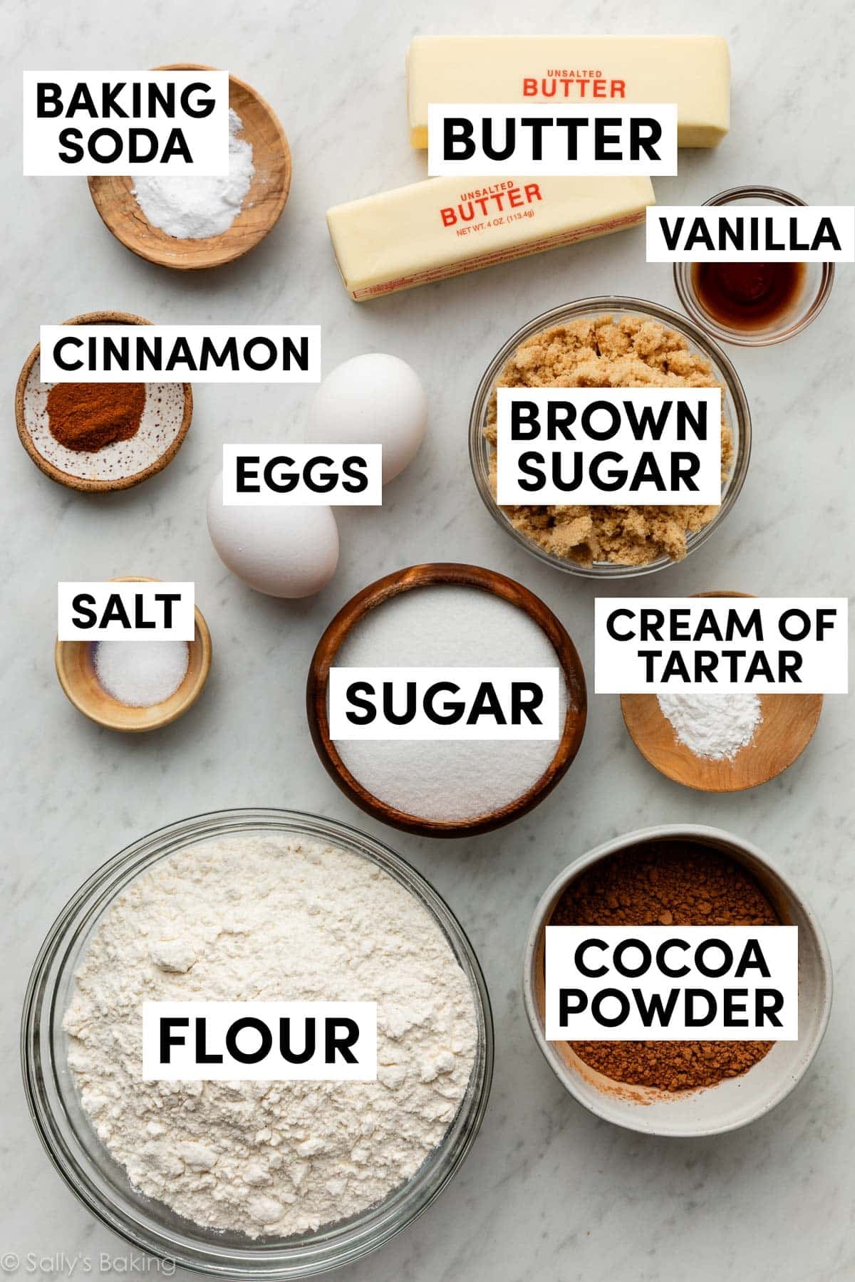 ingredients in bowls including butter, sugar, brown sugar, cocoa powder, and flour.