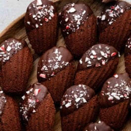 chocolate peppermint madeleines on wooden plate.