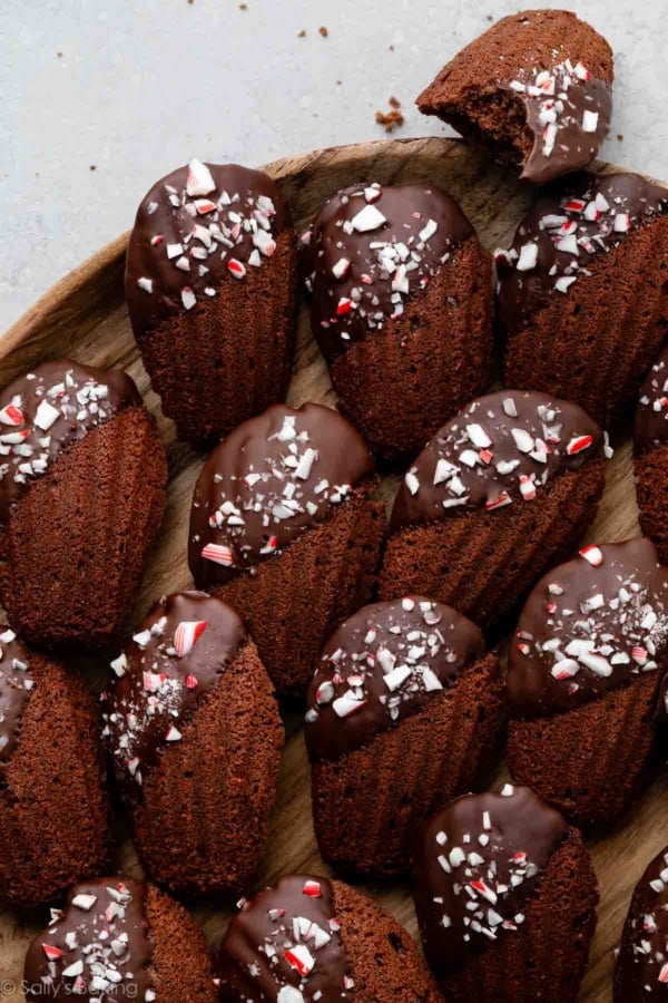 chocolate peppermint madeleines on wooden plate.