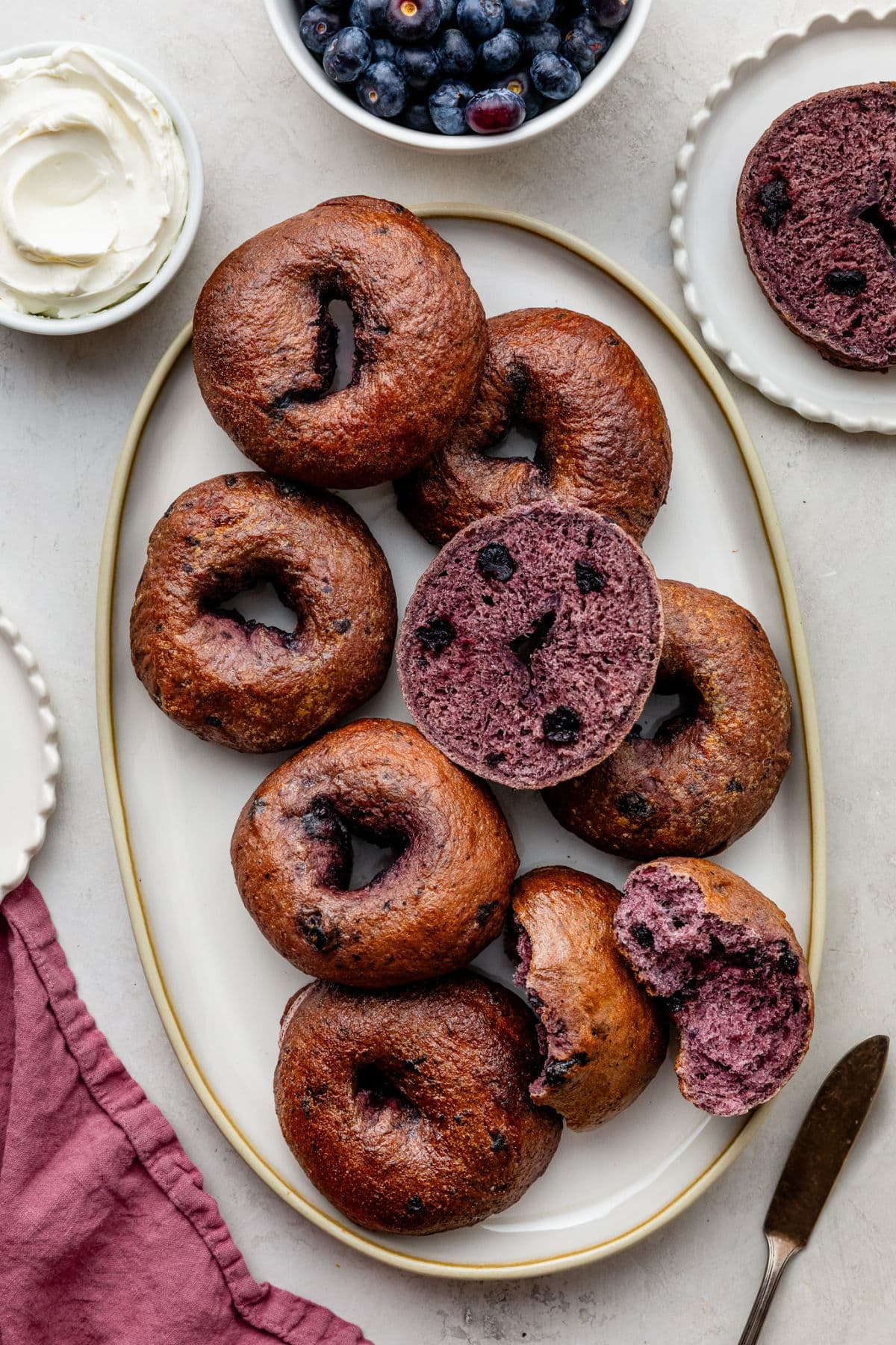 blueberry bagels on oval serving dish.