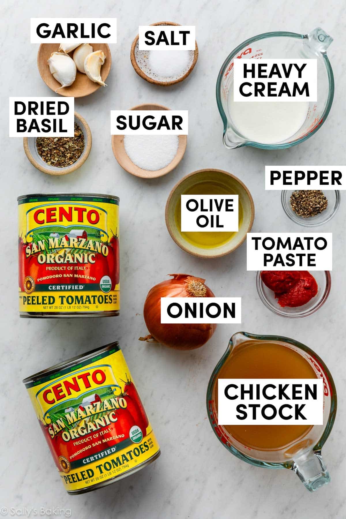 ingredients measured in bowls including cream, olive oil, pepper, sugar, salt, basil, and garlic.