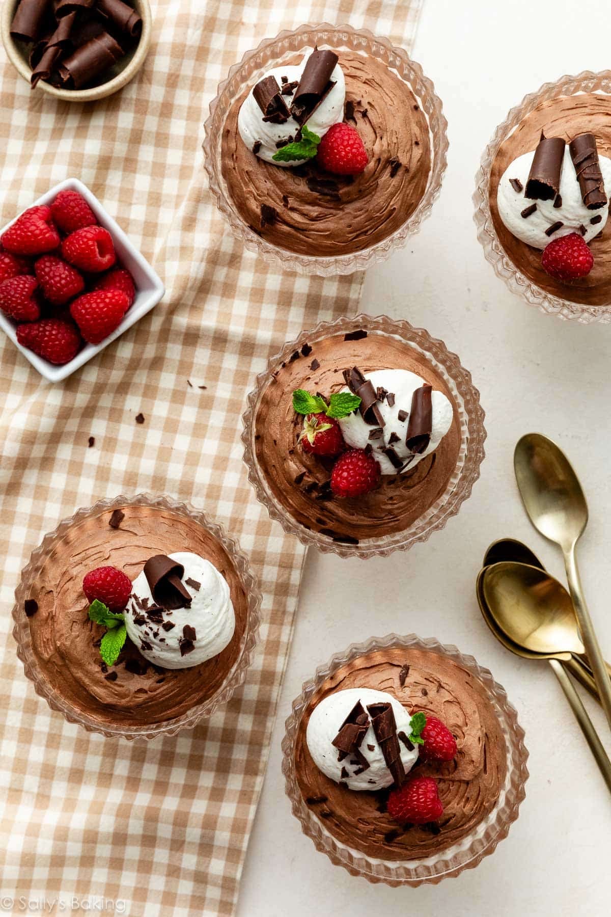 chocolate mousse with whipped cream and chocolate curls.