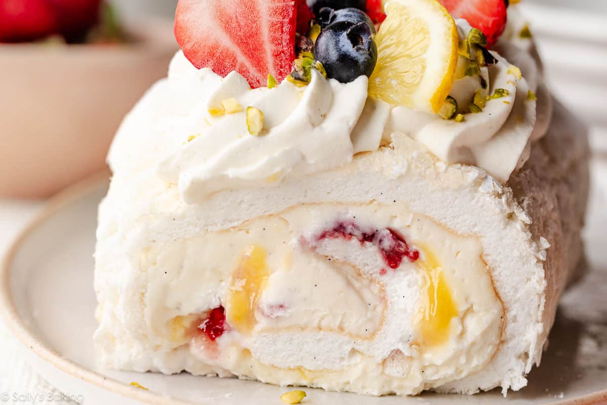 meringue roulade with fresh berries and lemon curd.