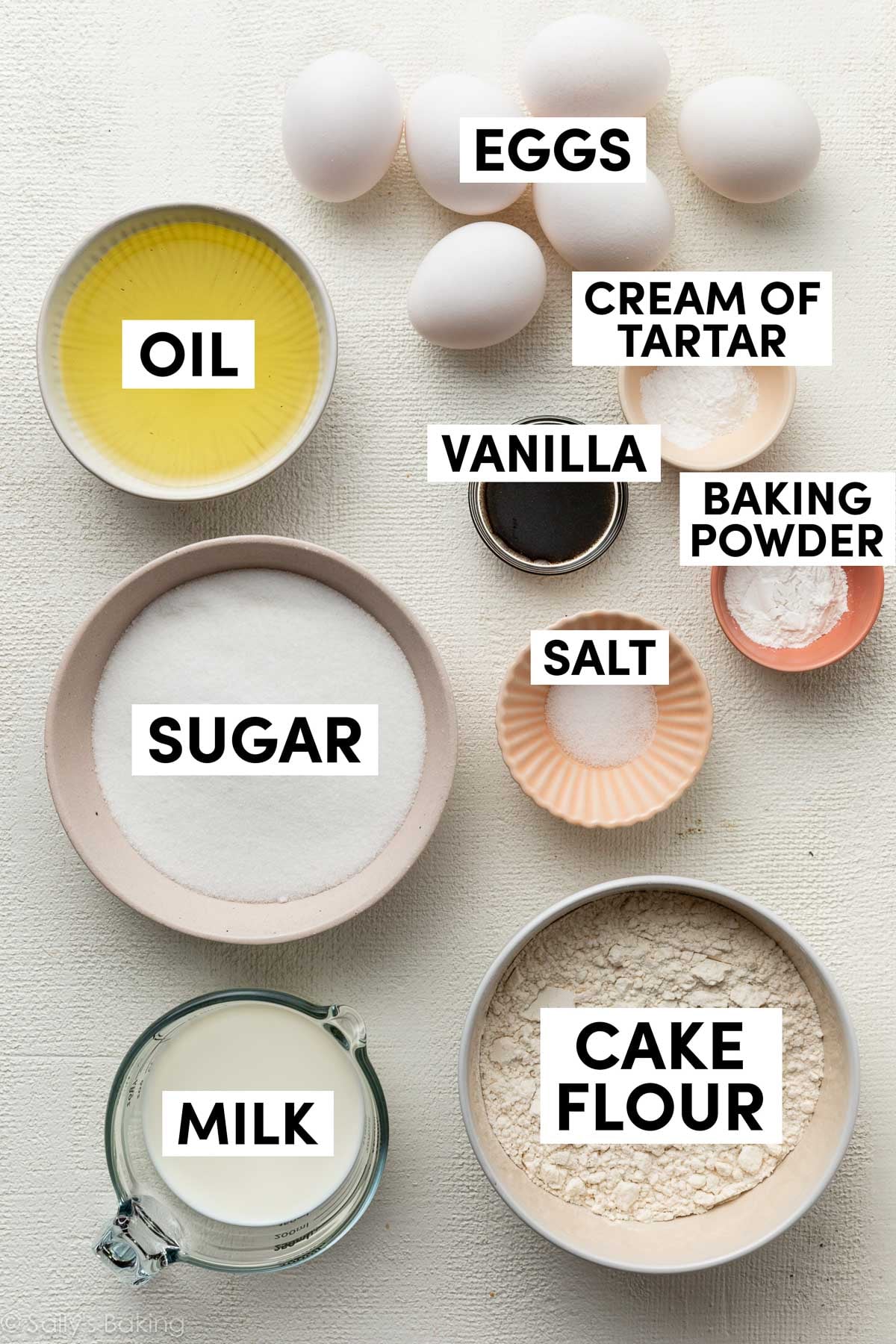 ingredients in bowls including oil, sugar, cake flour, and milk.