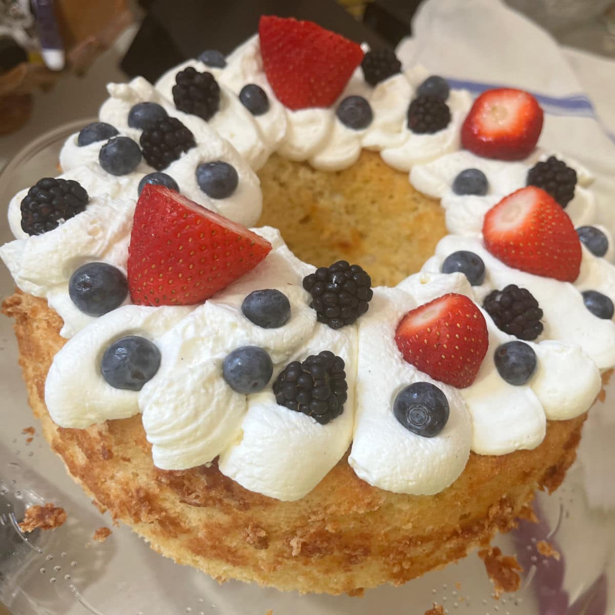 chiffon cake with whipped cream on top.